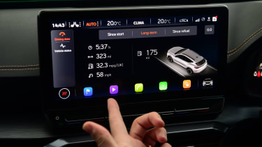 Auto Express deputy editor Richard Ingram operating the Cupra Formentor's infotainment system